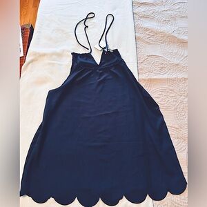 Cute navy sleeveless top w scalloped bottom; adjustable tie back; Size Medium